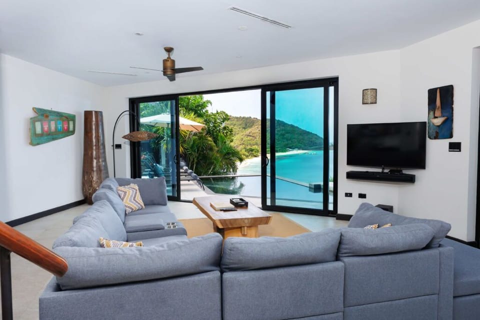 Unwind on plush sofas as the coastline fills the windows.