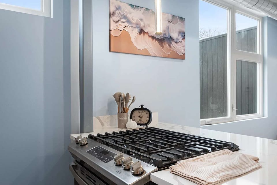 Modern gas cooktop with cookware and cooking essentials, perfect for preparing everything from quick breakfasts to home-cooked dinners.