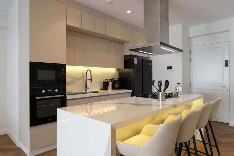 Modern kitchen with a spacious island, breakfast bar, and premium finishes.