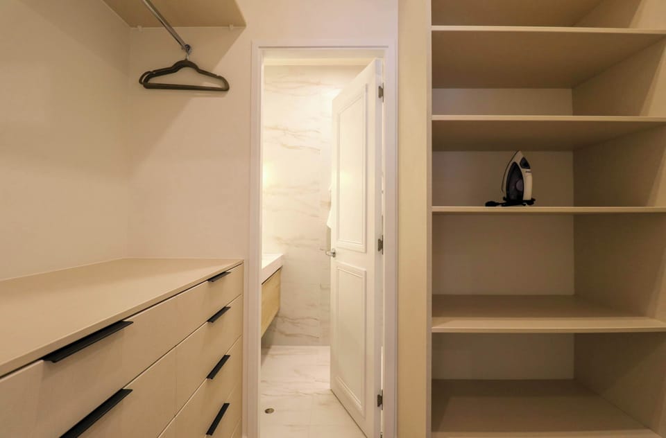 Built-in closet offering convenient storage space for guests.