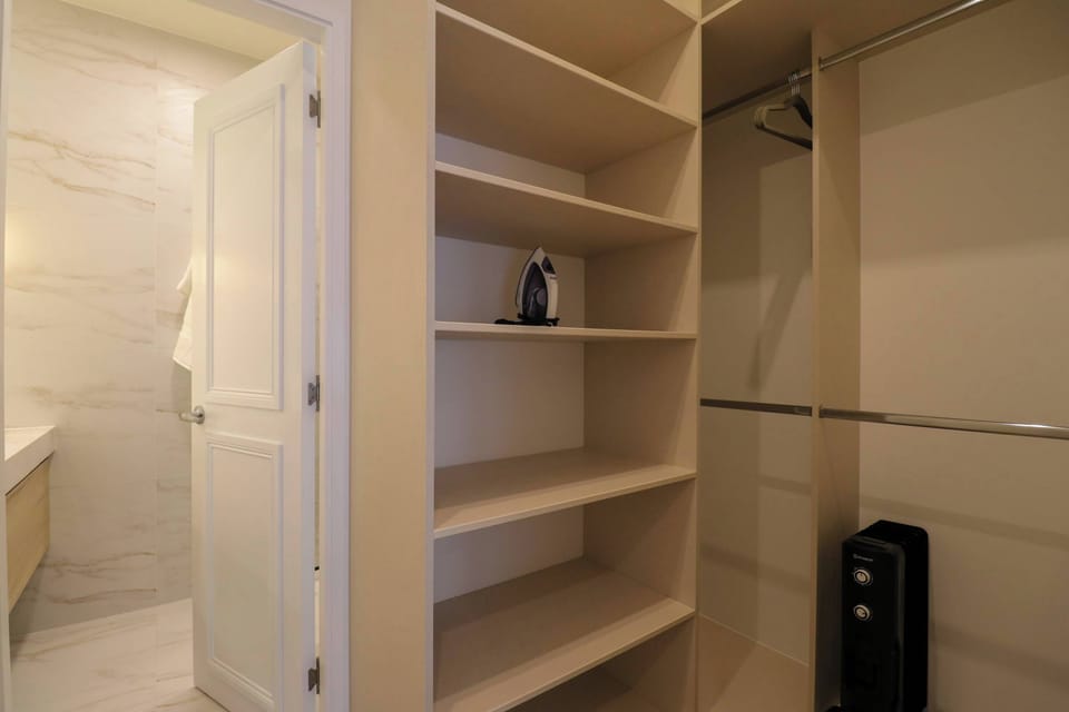 Organized closet area with shelves and storage space.