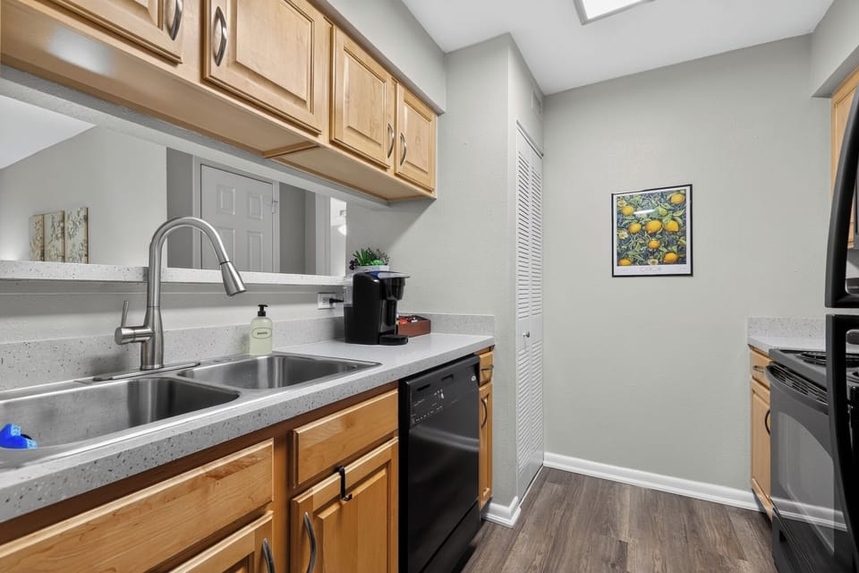 Bright galley kitchen with modern finishes and plenty of prep space