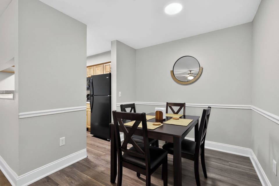Bright dining nook for 4 with modern finishes and easy kitchen access