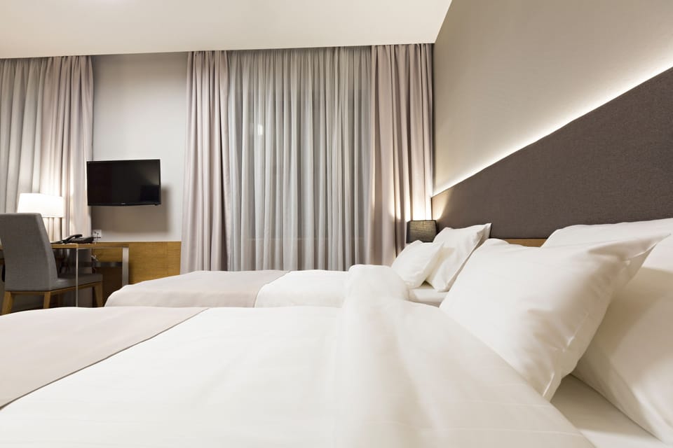 Deluxe Double or Twin Room, 1 Bedroom, Courtyard View | Minibar, in-room safe, desk, soundproofing