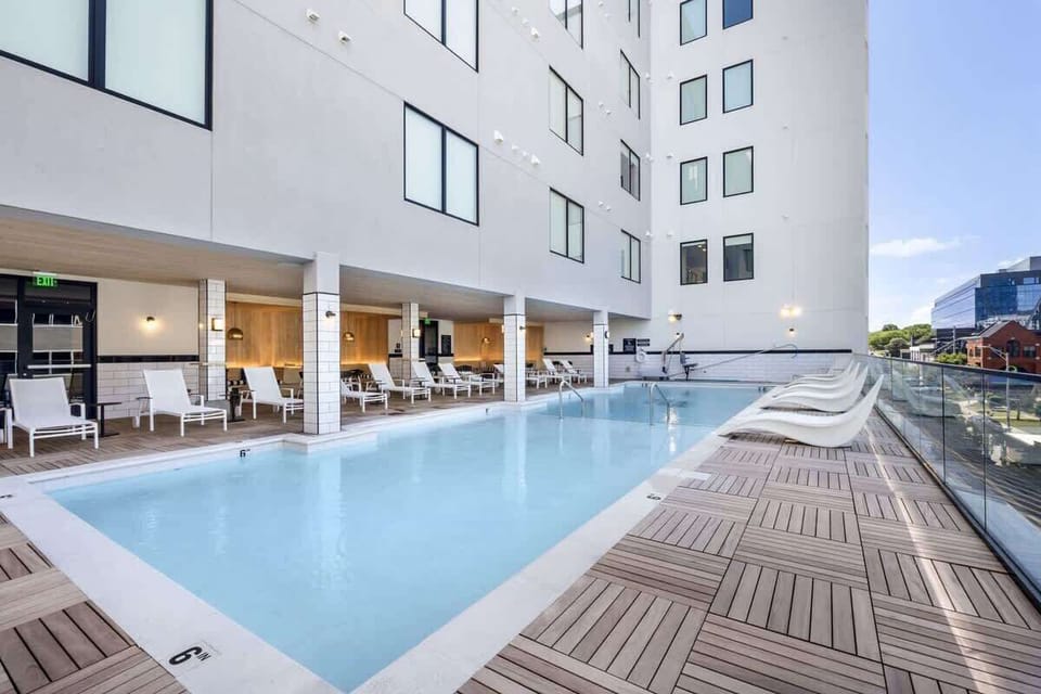 Communal Area: The Sparkling blue pool on the 3rd floor has city views and sun loungers.