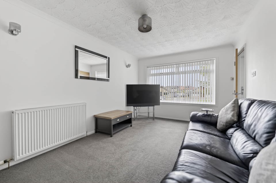 Spacious living room with Smart TV