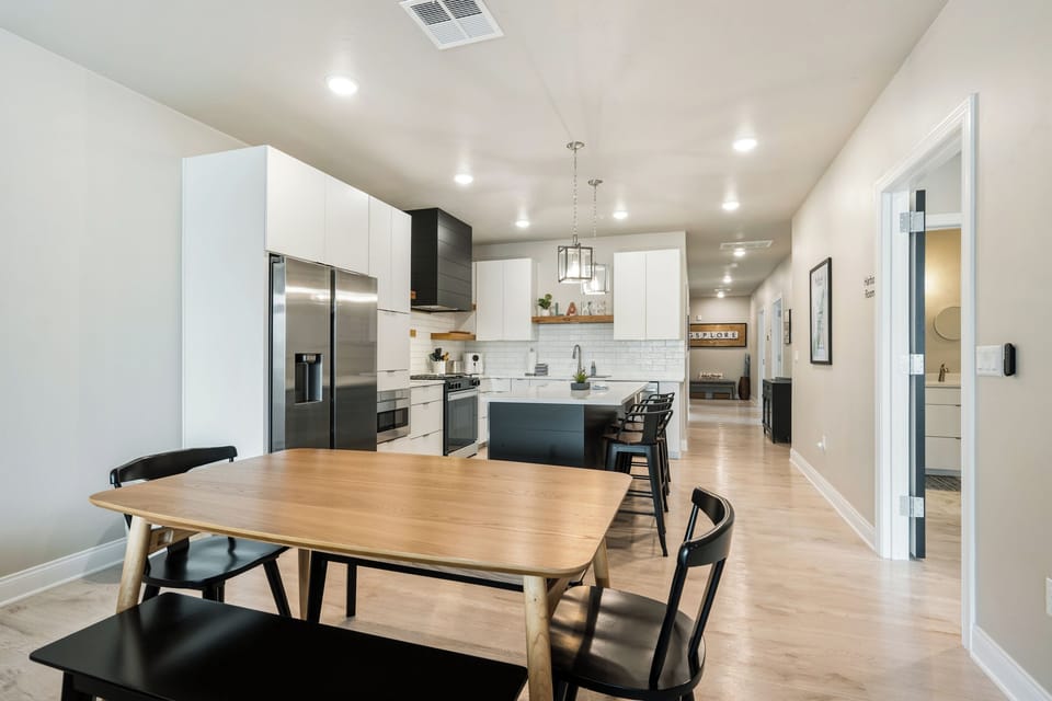 The dining table seats eight, creating a welcoming place for everyone to gather. Share home-cooked meals, plan the next day’s adventures, or settle in for a family game night