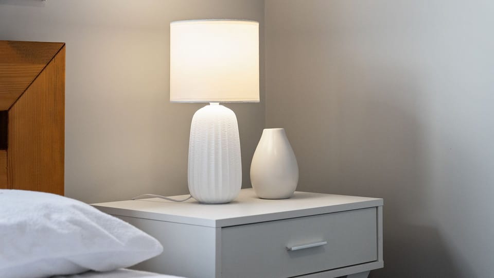 Bedside tables with reading lamps for added comfort and convenience.