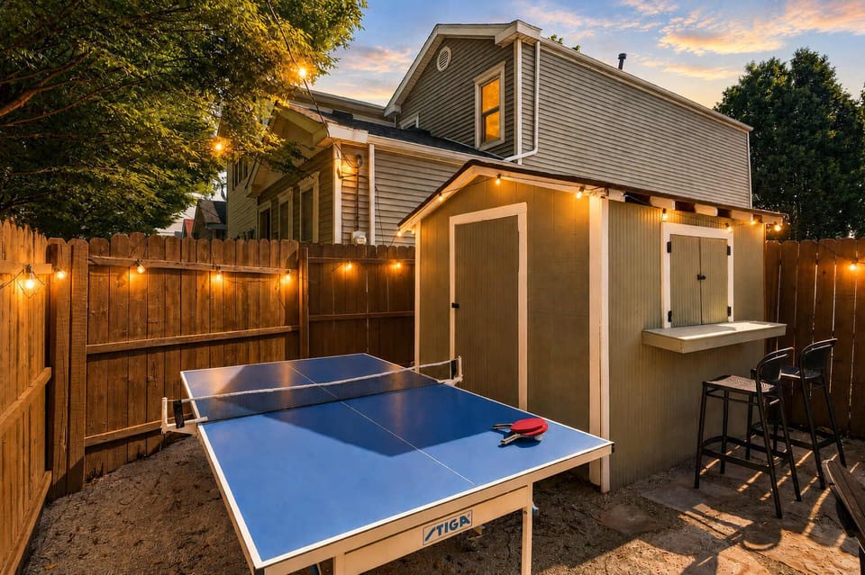 Backyard: Gather in the cozy backyard to soak in the hot tub, enjoy the warmth of the fire pit, challenge friends to ping pong, or simply unwind in the comfortable seating area.