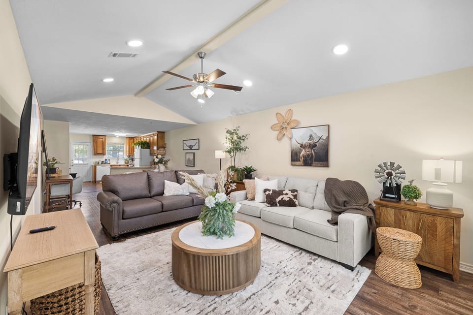 Bright open living room with cozy seating and easy flow to the kitchen