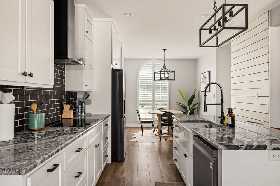 Modern kitchenette with stainless steel appliances, generous counter space, and a functional layout for preparing meals with ease.