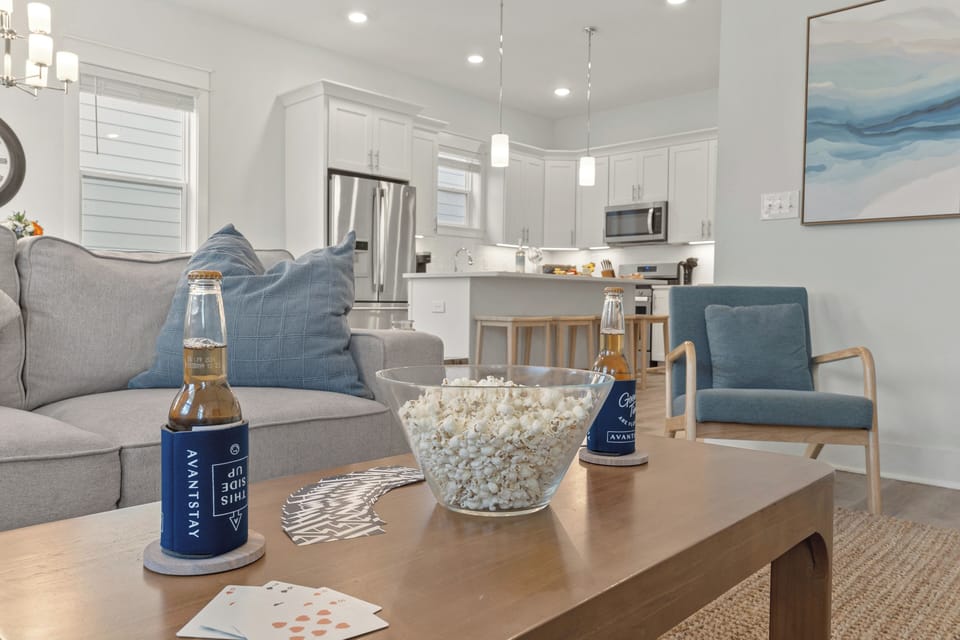 A comfortable living room offers generous seating, a large TV, and a relaxed setup for movie nights or downtime together.