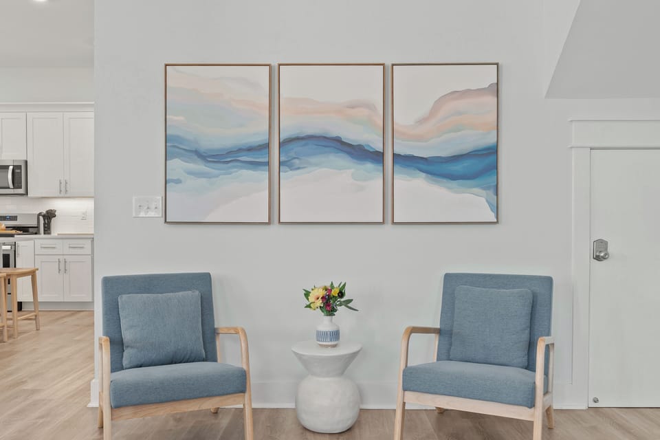 A comfortable living room offers generous seating, a large TV, and a relaxed setup for movie nights or downtime together.