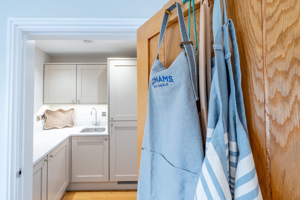 Ground floor: Utility room with washer/dryer, microwave and fridge/freezer