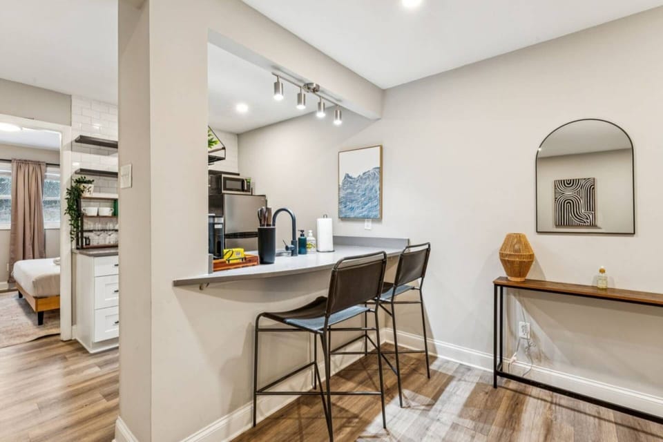 A stylish breakfast bar offers the perfect spot to dine, work, or unwind.