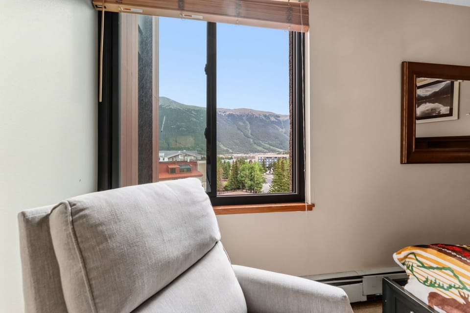 Sink into your cozy armchair and take in the stunning mountain views right from your window. The perfect spot to unwind and soak up the natural beauty surrounding you.