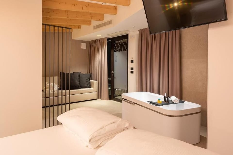 Junior Suite, Pool View | In-room safe, desk, blackout drapes, soundproofing