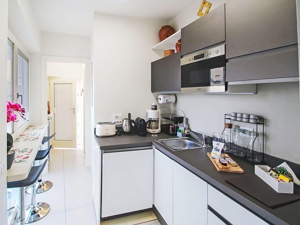 Kitchen, Kitchen Appliance, Countertop, Major Appliance, Interior Design, Cabinetry, Furniture, Home Appliance, Kitchen Stove, Flooring