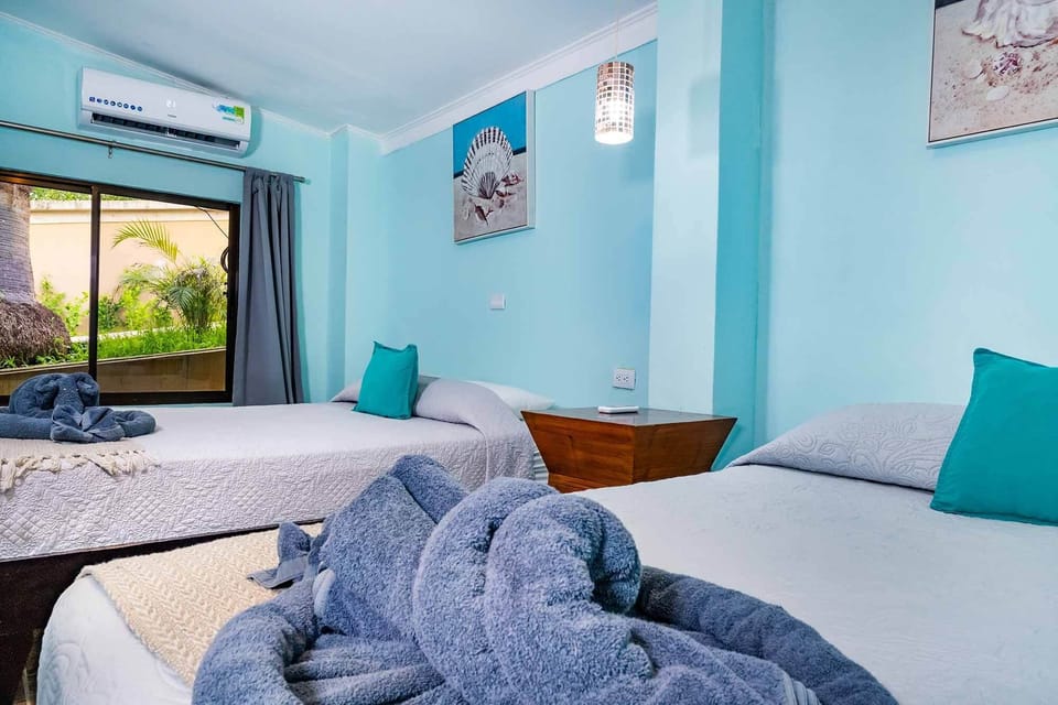Family Apartment, 2 Bedrooms, Garden View | In-room safe, desk, laptop workspace, iron/ironing board