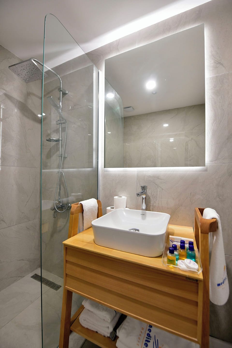 Shower, hair dryer, slippers, towels