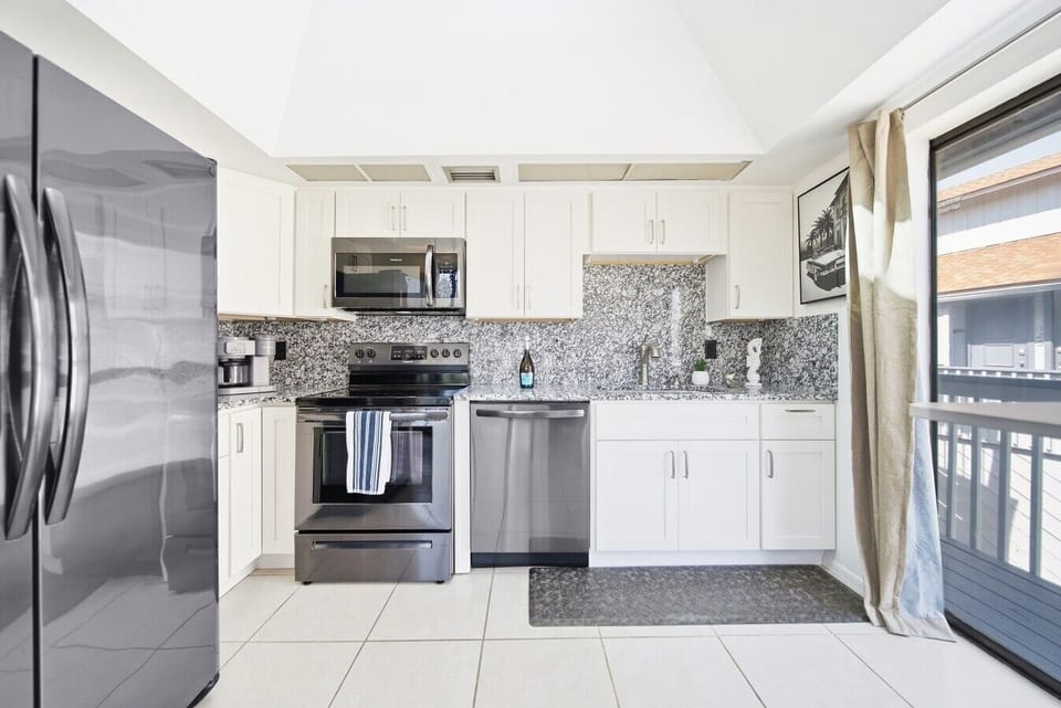 Kitchen, dishware, silverware, and cookware included