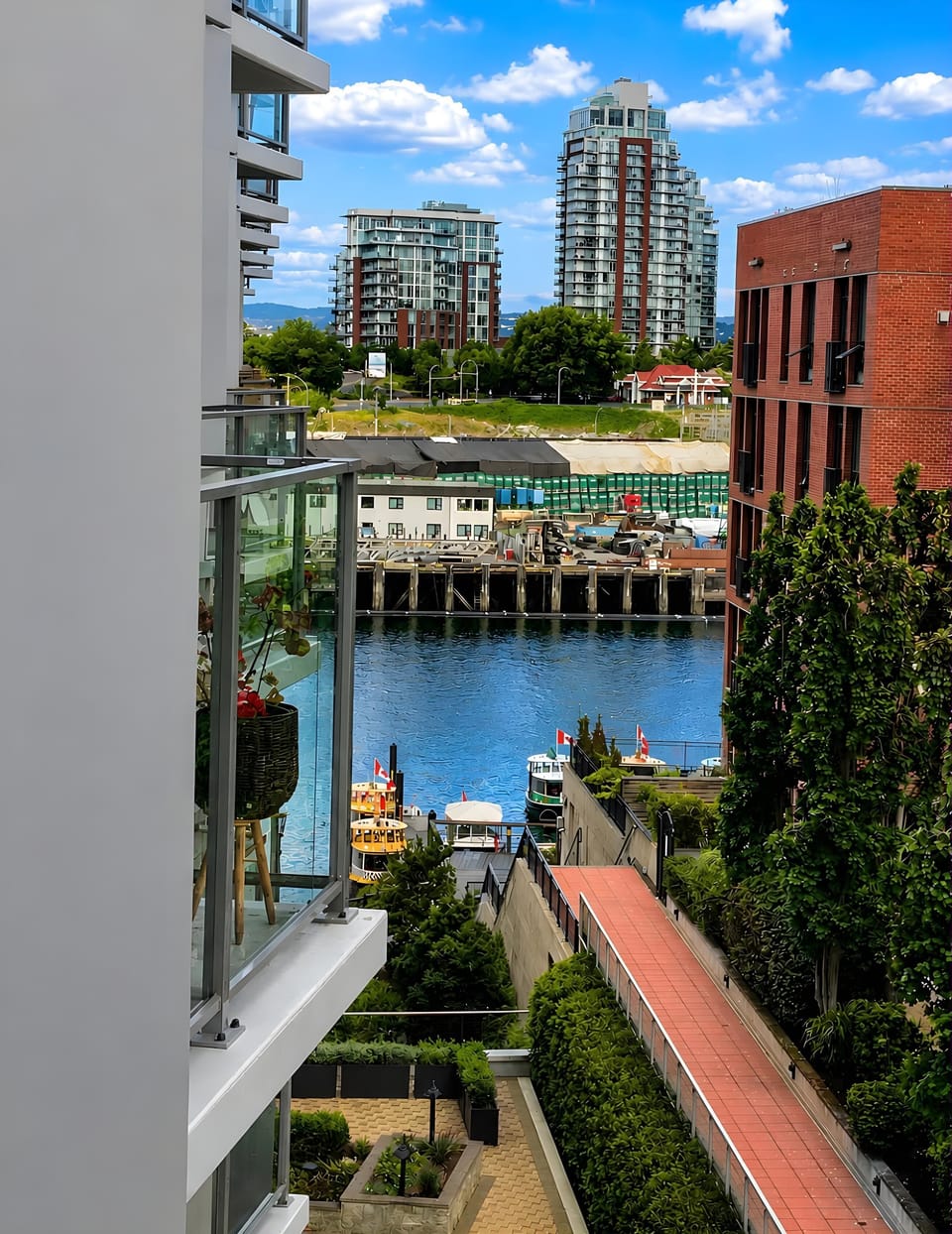 Scenic balcony view looking out across the surrounding waterfront property and harbor canal.