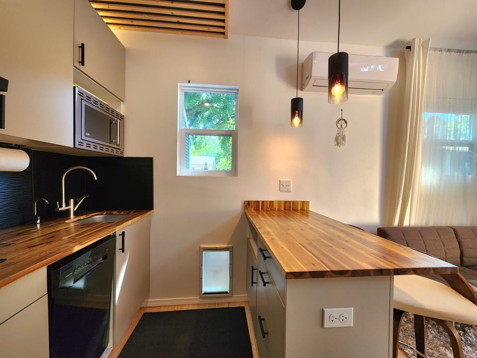 Butcher-style peninsula, and a doggie door if you are bringing your pet!
