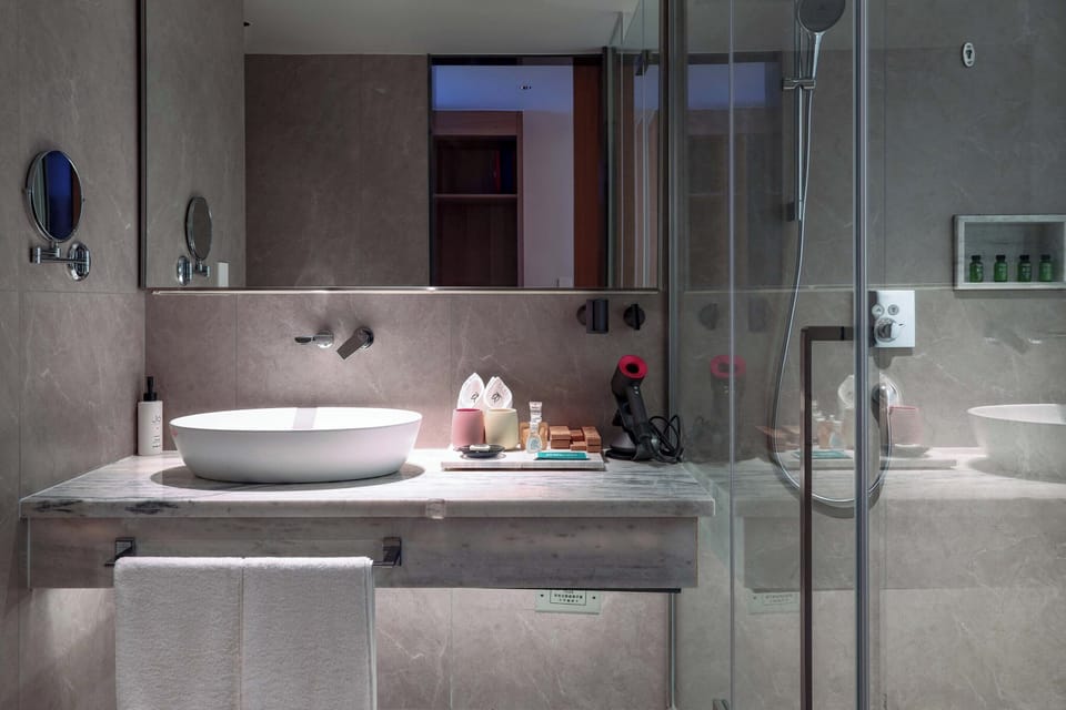 Luxury Suite, Balcony, Hill View | Bathroom | Free toiletries, hair dryer, towels, soap