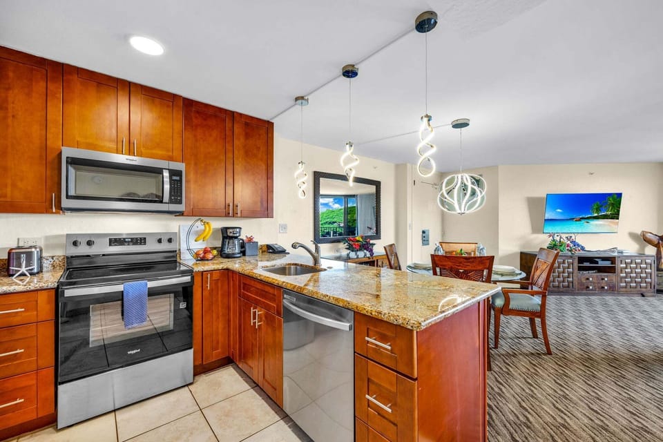 Cook, gather, and laugh in a sleek chef's kitchen that flows seamlessly into the heart of the home