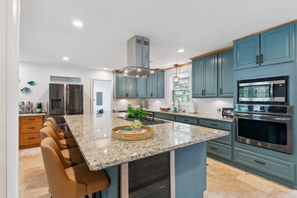 Prepare your favorite meals together in the spacious kitchen with an oversized island.