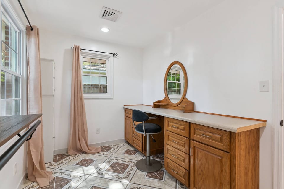 Get ready for a night out in the spacious walk-in closet and unique vanity area just off the primary bathroom.