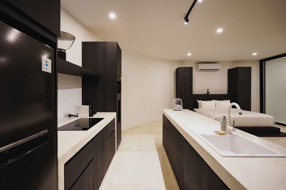 Deluxe Studio Suite, Partial Ocean View | Private kitchen | Full-size fridge, microwave, stovetop, cookware/dishes/utensils