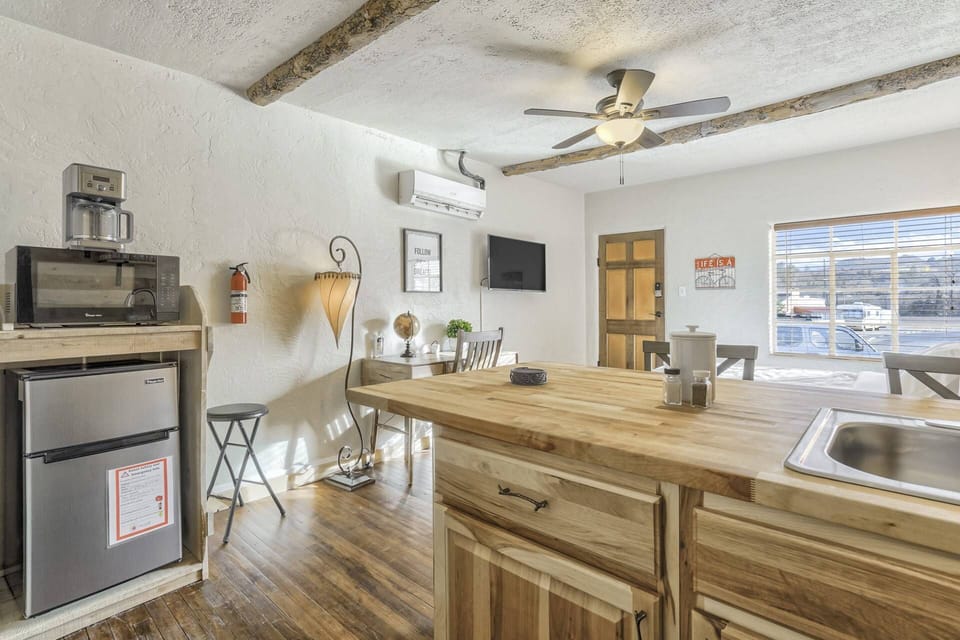 A modest kitchenette - sink, microwave, fridge