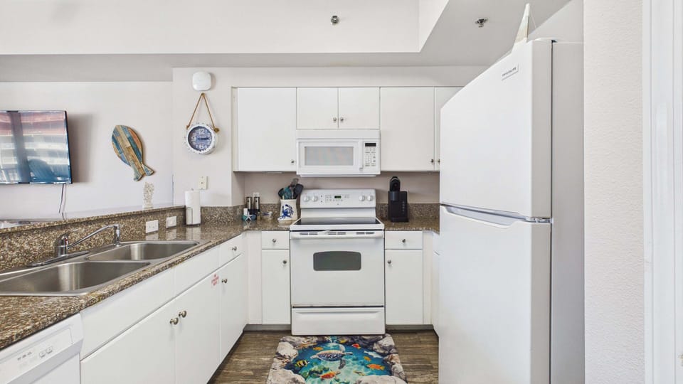 Fully applianced kitchen with coffee essentials and other additional appliances