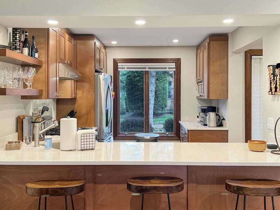 Breakfast nook with three stools.