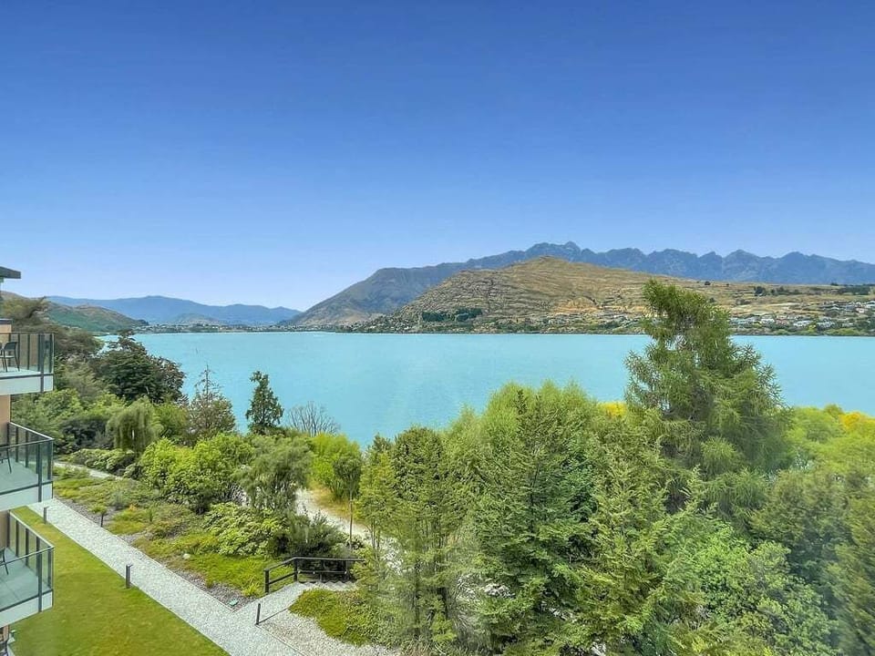 Wake up to sweeping views across Lake Wakatipu and Queenstown's surrounding alpine landscape.