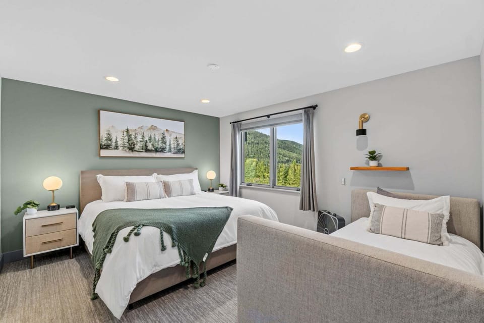 Upper Primary Suite -
A luxurious king bed with a plush pillow-top mattress and cloud-like bedding creates a restful private retreat. A twin daybed provides additional sleeping flexibility.