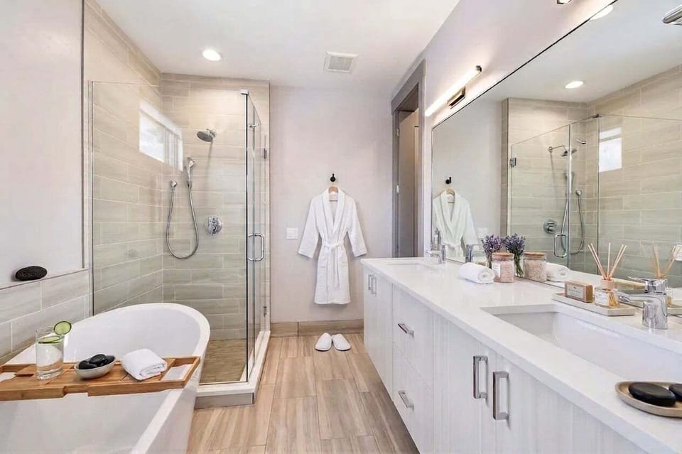 Spa-Inspired Bathroom -
Unwind in the soaking tub or spacious glass-enclosed shower, complemented by premium bath amenities and thoughtful essentials.