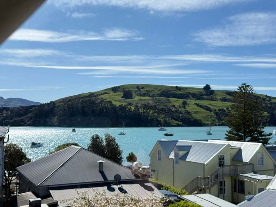 Sea View Family Stay Akaroa — a bright, spacious three-level home with harbour views and easy walk to cafés