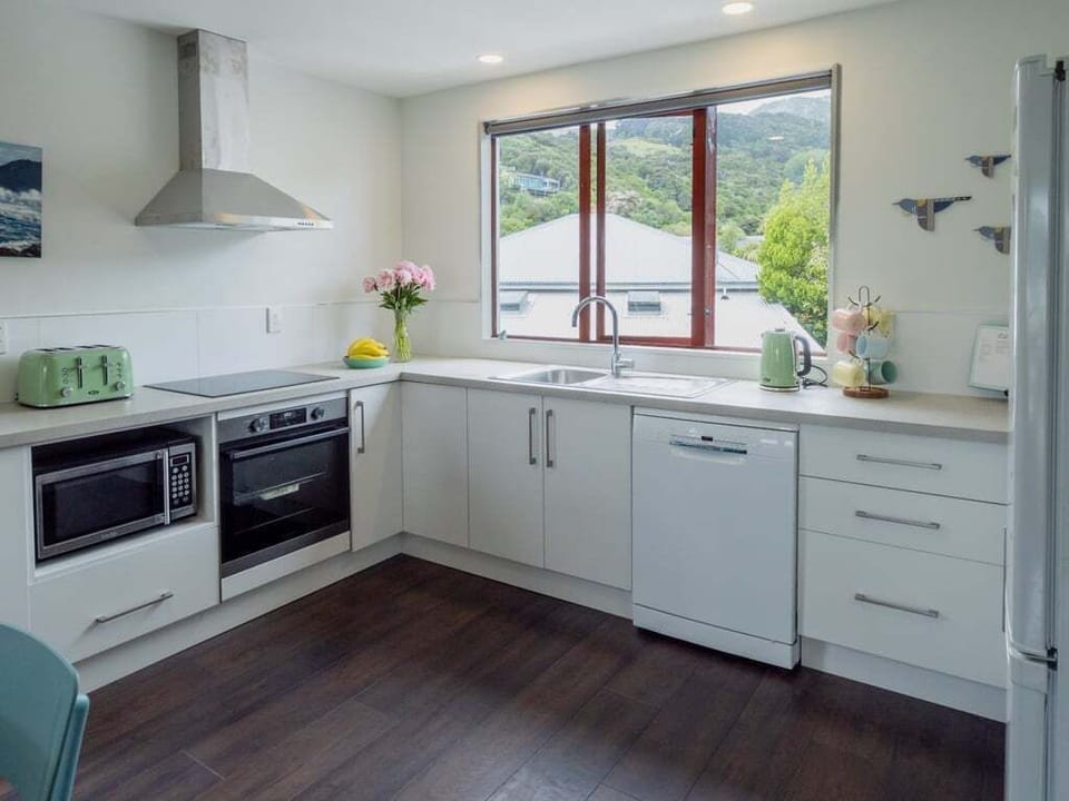 Bright, functional kitchen perfect for preparing breakfast before a harbour stroll
