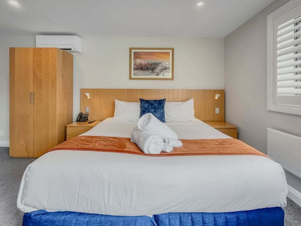 Plush king bedroom with heat pump comfort
