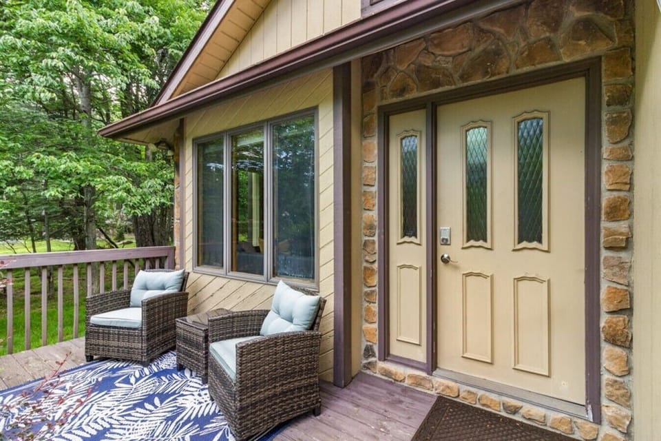 Front porch seating welcomes you to your Pocono escape.