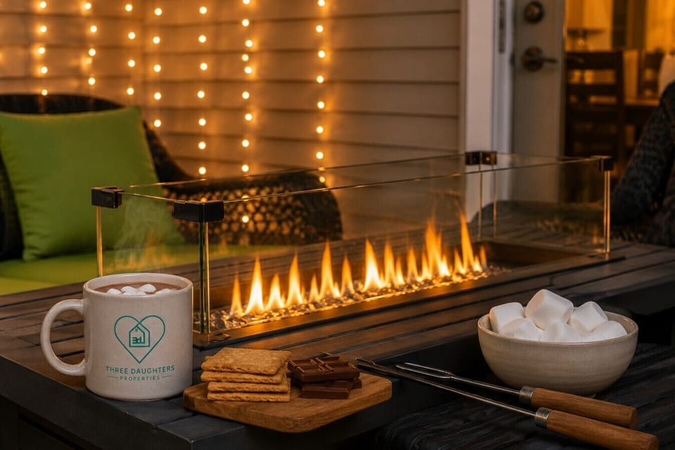 Cozy up by the outdoor fireplace with a warm drink and s’mores.