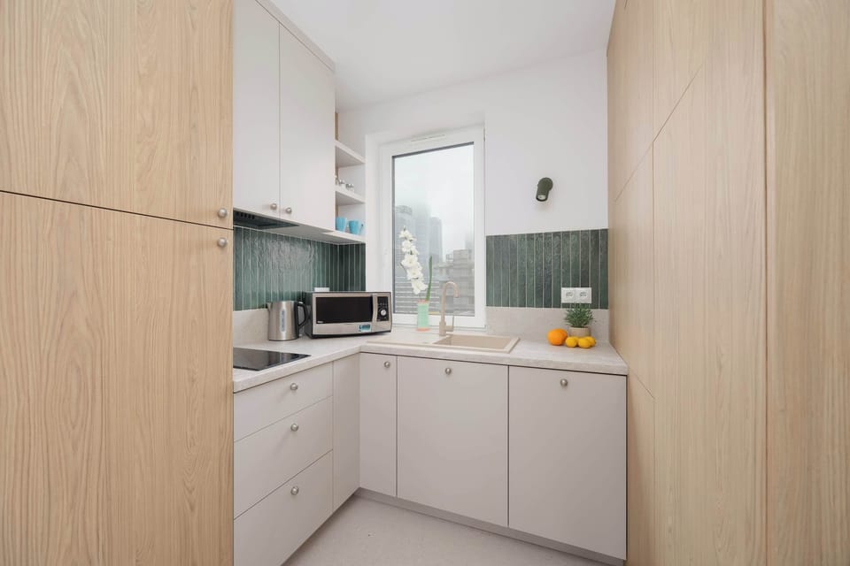 The kitchen offers a functional layout for convenient cooking.
