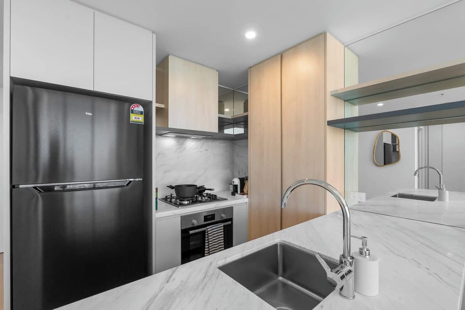 Prepare meals with ease in the stylish gourmet kitchen featuring stone benchtops, quality appliances, ample storage and all your everyday cooking essentials.