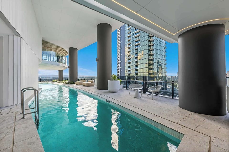 Unwind in the stunning residents-only swimming pool, surrounded by stylish lounge areas and contemporary resort-style amenities.