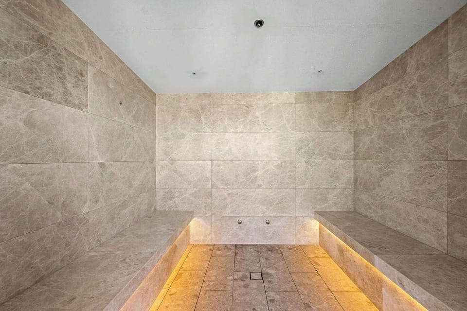 Enjoy the luxurious steam room, providing a tranquil wellness experience to complement the building's premium lifestyle facilities.