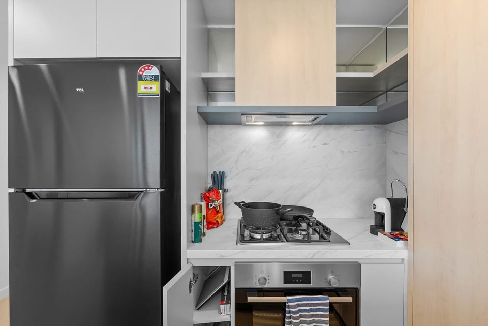 The modern kitchen is fully equipped with quality appliances, a gas cooktop, oven, Nespresso coffee machine and everything needed for a comfortable self-catering stay.