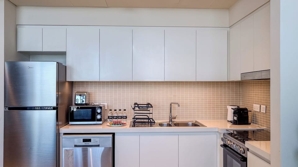 Deluxe Apartment, Balcony, Harbor View | Private kitchen | Coffee/tea maker