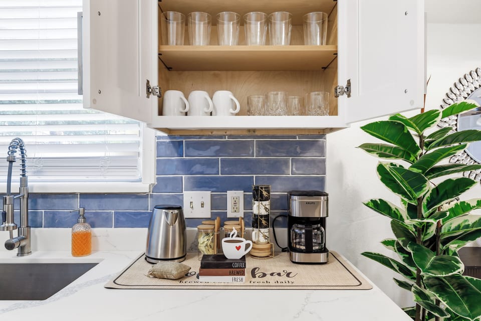 Drip coffee machine with complimentary coffee, decaf, tea, sugar, cream, and sweetener